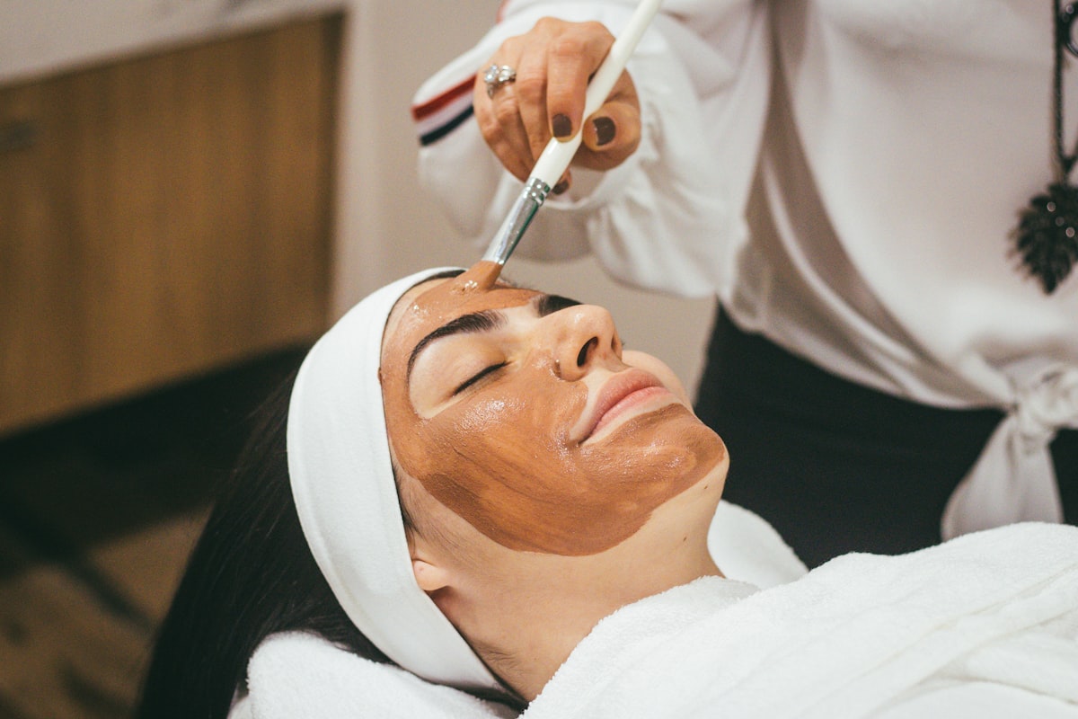 Woman receiving a relaxing facial treatment